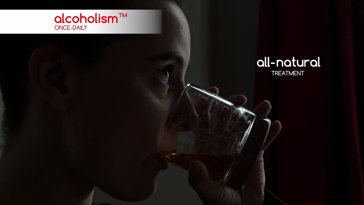 A woman drinks from a whiskey glass. A medication-style title on the top left reads, "alcoholism™, once-daily." On the right is the title, "all-natural treatment."